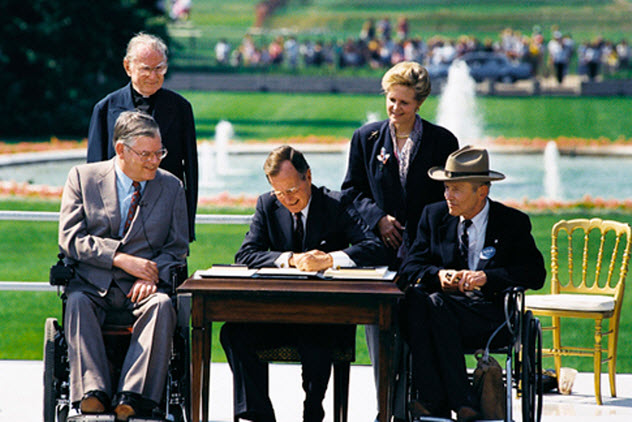 President George H.W. Bush signs the Americans with Disabilities Act (ADA) into law.